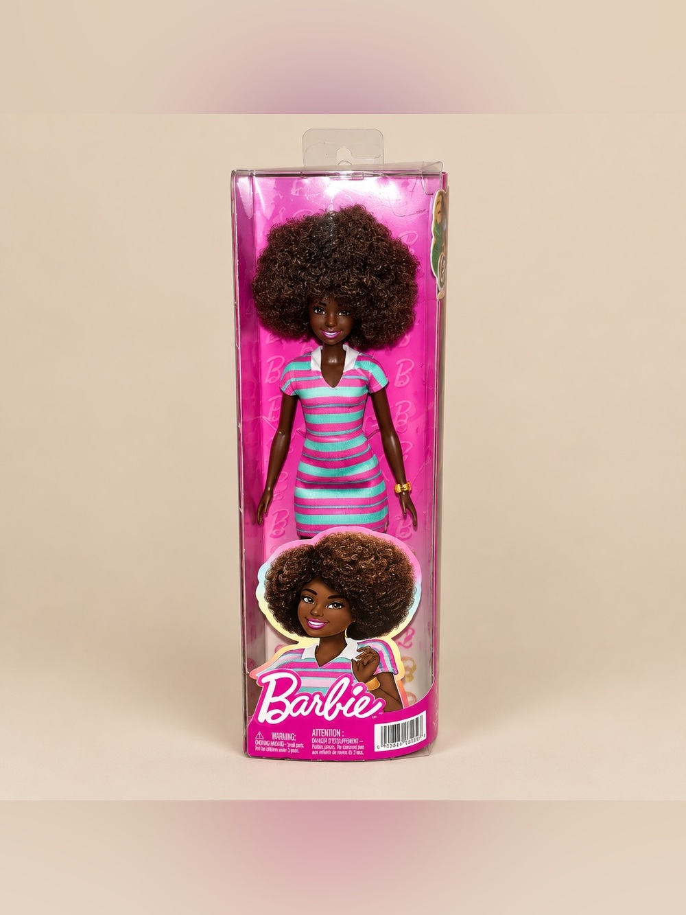 Fashionistas Doll #247 features curly black hair and wears a pink and green
